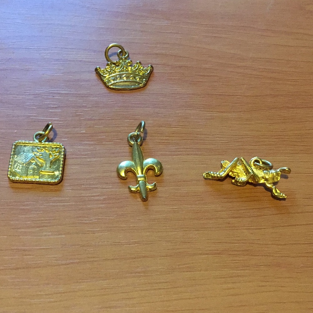 4 golden Tone charms.each unique for necklace/bracelet. Costume Jewelry Charms.